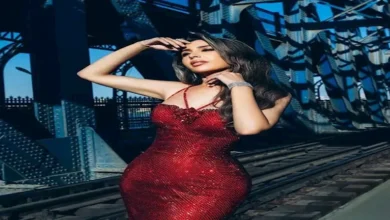 جنات تتألق بإطلالة أنيقة بفستان أحمر ناري